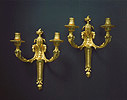 A fine pair of Louis XVI gilt bronze two-light wall-lights